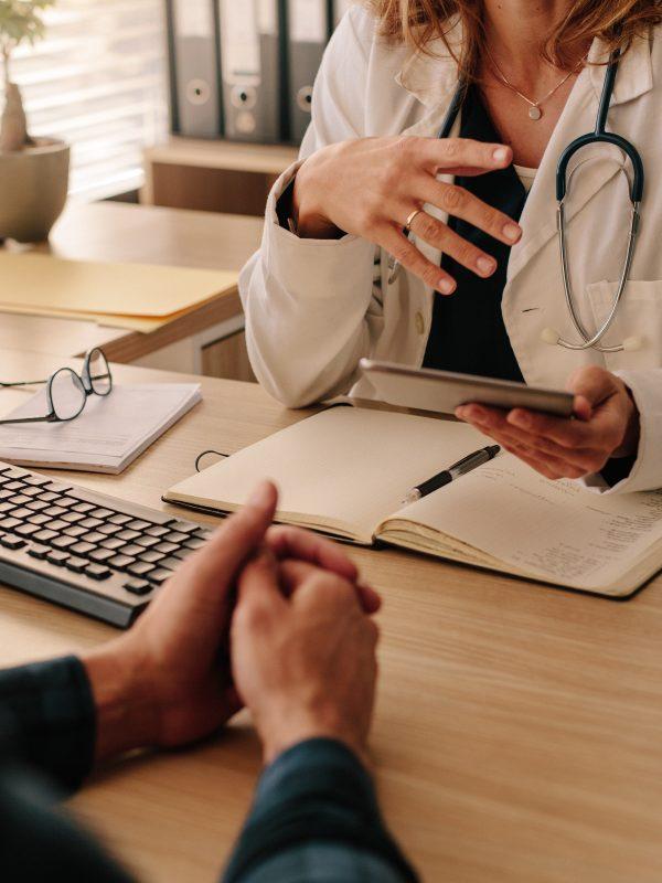 Doctor And Patient Talking About The Treatment