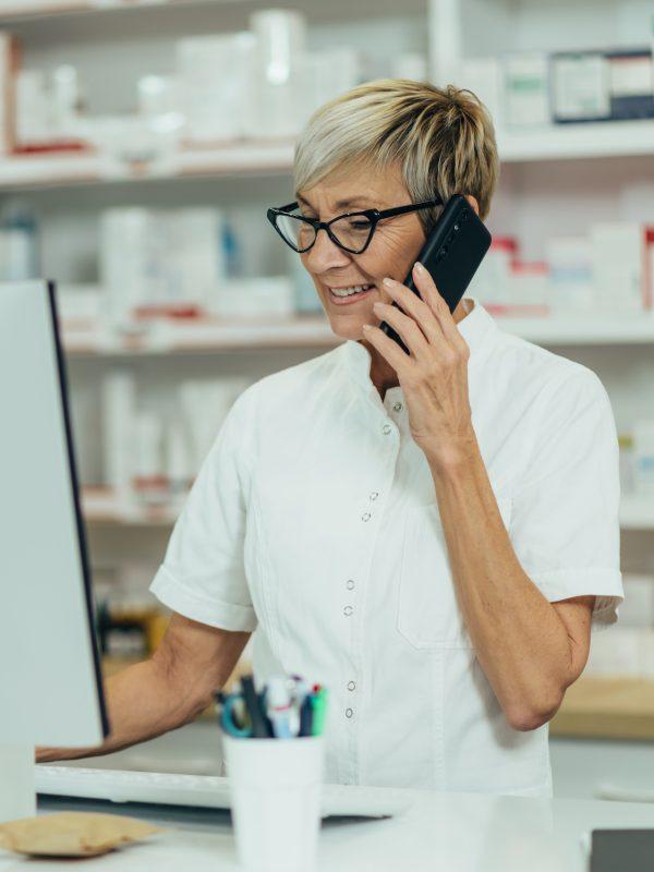 Portrait Of A Beautiful Senior Female Pharmacist Working In A Pharmacy