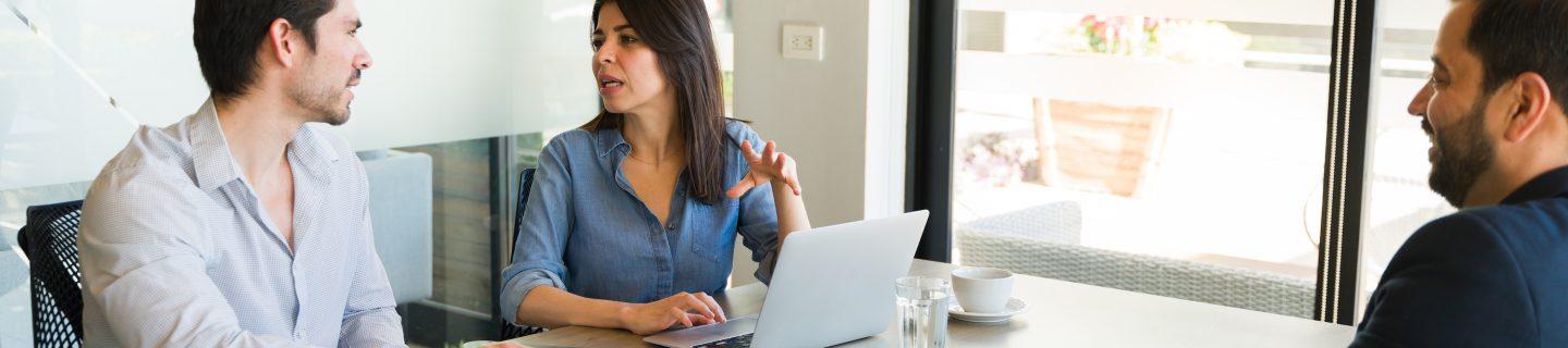 Businesspeople Discussing The Resume Of A Job Candidate During An Interview